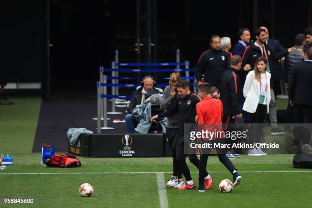 Diego Simeone head coach of Atletico Madrid plays football with his sons during a training session at Stade de Lyon ahead of the UEFA Europa League...