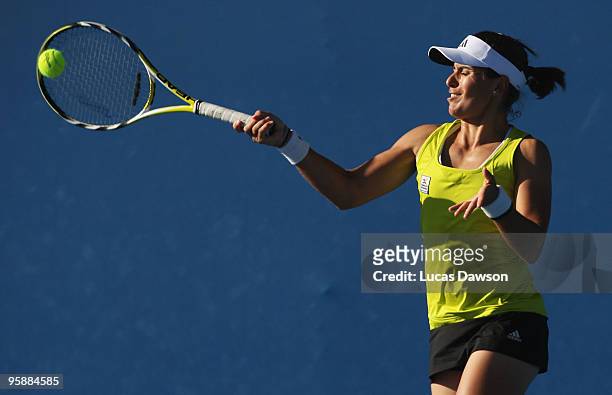 Anabel Medina Garrigues of Spain plays a forehand in her first round doubles match with Caroline Wozniacki of Denmark against Timea Bacsinszky of...