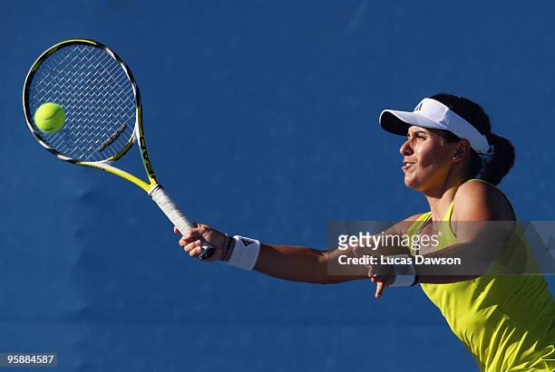 Anabel Medina Garrigues of Spain plays a forehand in her first round doubles match with Caroline Wozniacki of Denmark against Timea Bacsinszky of...