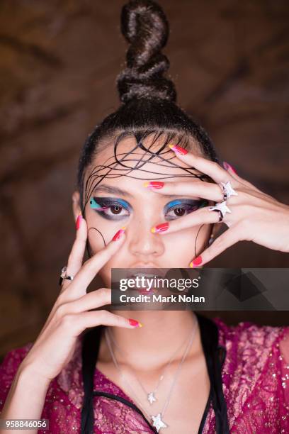 Model poses backstage ahead of the Romance Was Born show at Mercedes-Benz Fashion Week Resort 19 Collections at Restaurant Hubert on May 15, 2018 in...