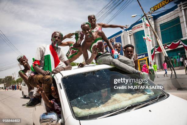 Men painted in colours of Somaliland's flag take part in celebrations of the 27th anniversary of self-declared independence of Somaliland in...