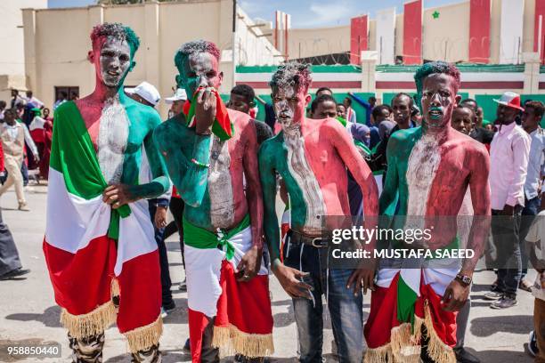 Men painted in colours of Somaliland's flag take part in celebrations of the 27th anniversary of self-declared independence of Somaliland in...