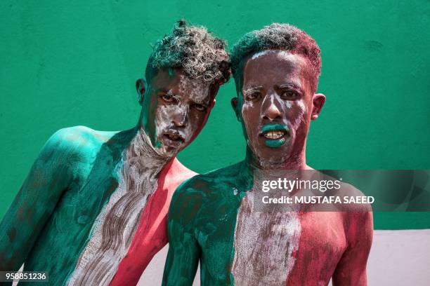 Men painted in colours of Somaliland's flag take part in celebrations of the 27th anniversary of self-declared independence of Somaliland in...