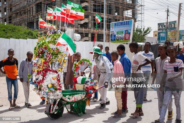 Man pushes his decorated wheelbarrow during celebrations of the 27th anniversary of self-declared independence of Somaliland in Hargeisa,...