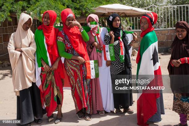 Women wrapped in Somaliland's flags take part in celebrations of the 27th anniversary of self-declared independence of Somaliland in Hargeisa on May...