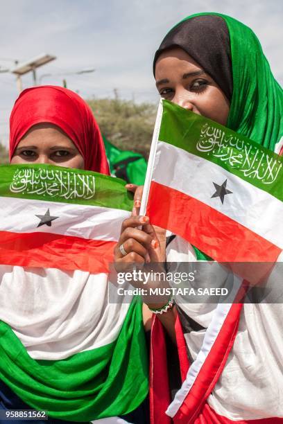 Women wrapped in Somaliland's flags take part in celebrations of the 27th anniversary of self-declared independence of Somaliland in Hargeisa on May...