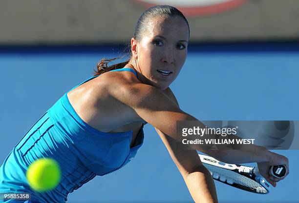 Serbian tennis player Jelena Jankovic plays a backhand return during her women's singles match against British opponent Katie O'Brien on the third...