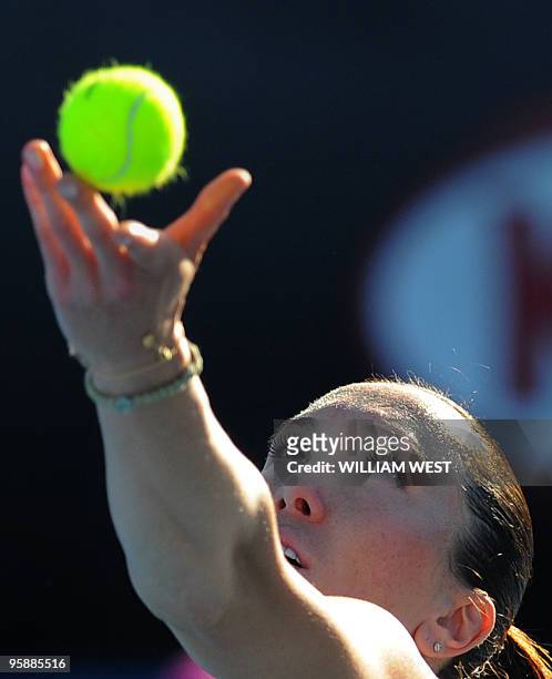 Serbian tennis player Jelena Jankovic serves during her women's singles match against British opponent Katie O'Brien on the third day of play at the...