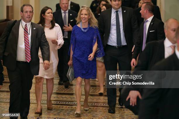 White House Press Secretary Sarah Huckabee Sanders talks with Counselor to the President Kellyanne Conway as they head to the weekly Senate...