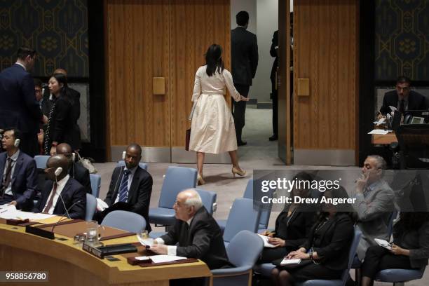 Ambassador to the United Nations Nikki Haley walks out of the chamber as Permanent Observer of Palestine to the United Nations Riyad Mansour begins...