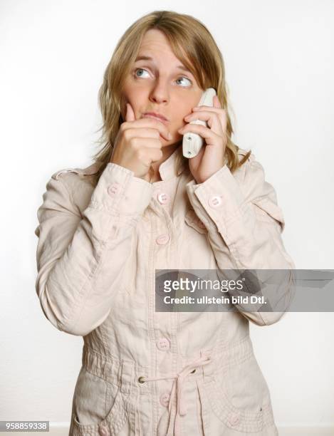 Young woman with a telephone -