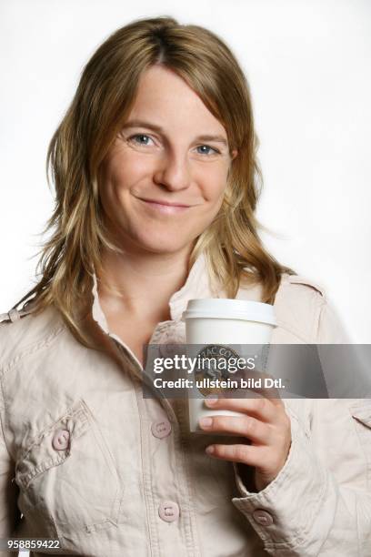 Young woman with paper cup of Balzac Coffee -