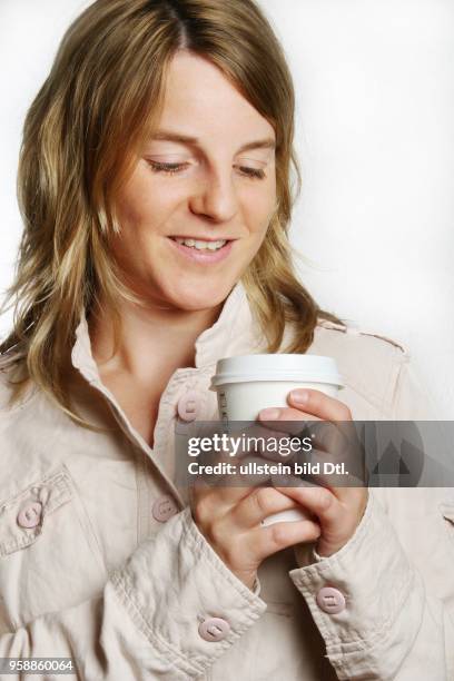 Young woman with paper cup -