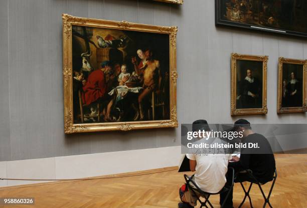 Germany - Bavaria - Muenchen Munich: Old Pinakothek - students in front of the painting "The Satyr and the Peasant" by painter Jakob Jordaens