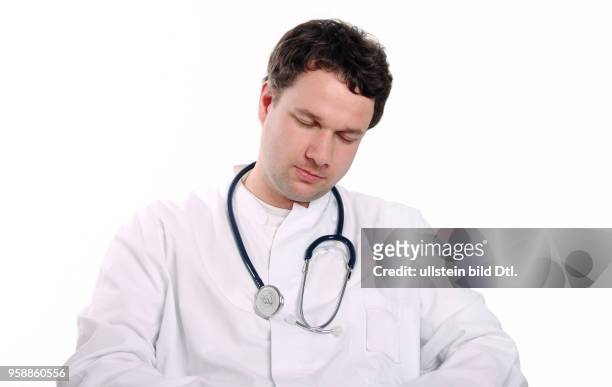 Exhausted doctor with stethoscope -