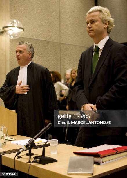 Far-right Dutch MP Geert Wilders stands as his lawyer Bram Moszkowicz addresses the court during a preparatory hearing ahead of his trial for...