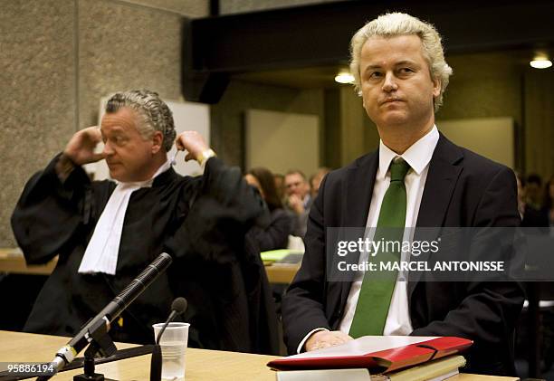 Far-right Dutch MP Geert Wilders sits beside his lawyer Bram Moszkowicz during a preparatory hearing ahead of his trial for inciting hatred against...