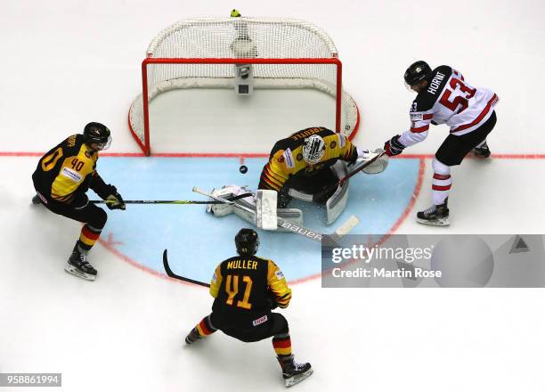 Nicklas Treutle, goaltender of Germany tends net against Bo Horvat of Canada during the 2018 IIHF Ice Hockey World Championship Group B game between...