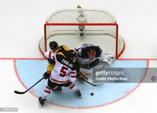 Darcy Kuemper, goaltender of Canada tends net Nicolas Krammer of Germany during the 2018 IIHF Ice Hockey World Championship Group B game between...