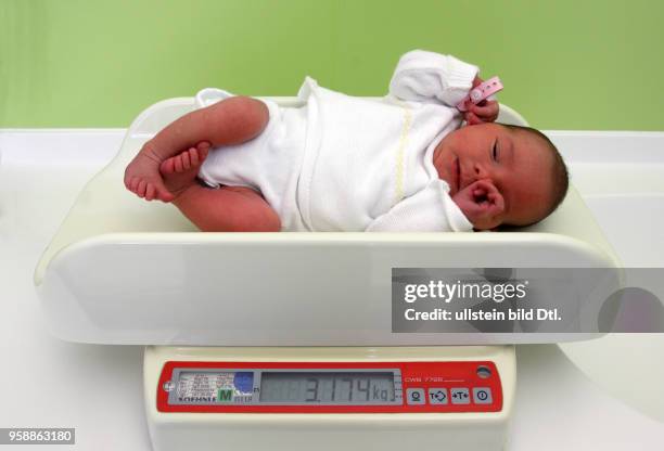 Germany - a baby lying on a baby scale -