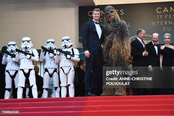 Finnish actor Joonas Suotamo and Chewbacca pose as they arrive on May 15, 2018 for the screening of the film "Solo : A Star Wars Story" at the 71st...