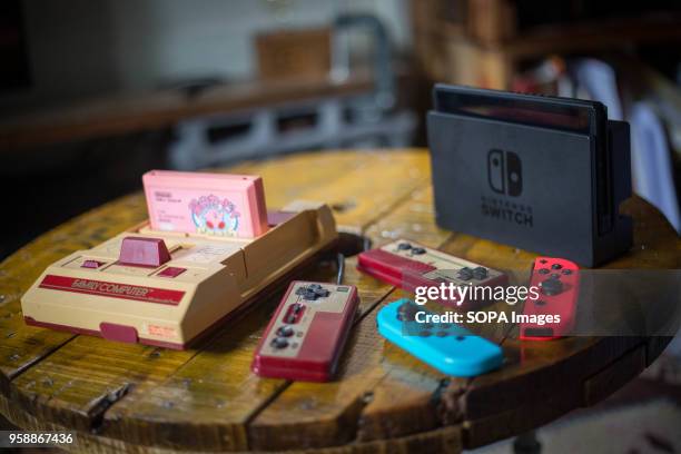 In this photo illustration, an old vintage Japanese market version of the Nintendo 'Family Computer' video game console knows also as 'Famicom'...