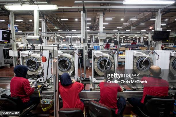 Vestel City employees work on a washing machine production line in the Vestel City mega factory on May 14, 2018 in Manisa, Turkey. The Vestel City...