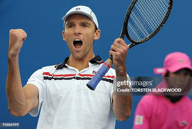Ivo Karlovic of Croatia celebrates his victory over Radek Stepanek of the Czech Republic in their men's singles first round match on day one of the...