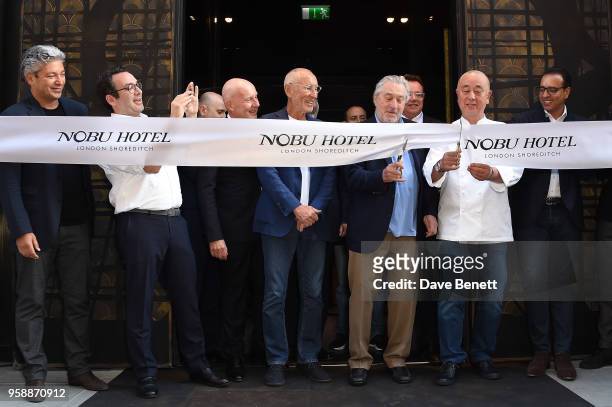 Trevor Horwell, Robert De Niro and Nobu Matsuhisa cut the ribbon for the opening ceremony at the Nobu Hotel London Shoreditch official launch event...