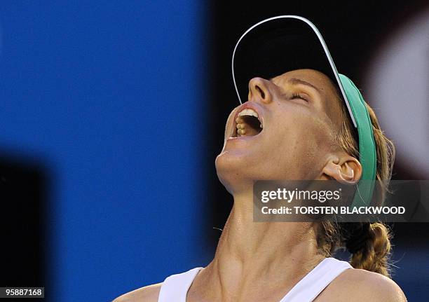 Elena Dementieva of Russia reacts while playing against Justine Henin of Belgium in their women's singles second round match on day three of the...