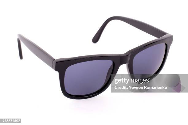 black sunglasses isolated on a white background - sunglasses isolated stockfoto's en -beelden