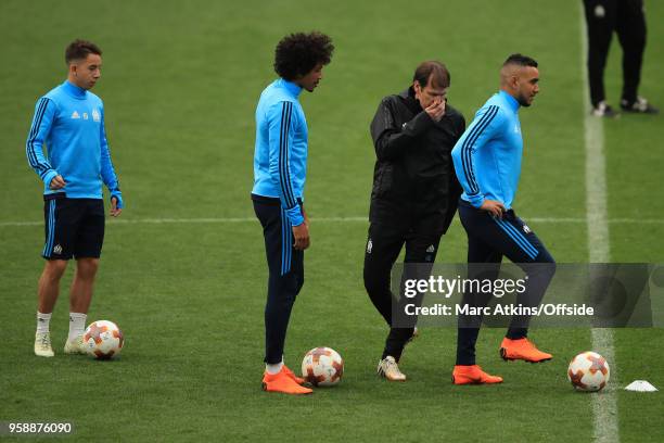 Olympique de Marseille head coach Rudi Garcia speaks with Dimitri Payet during a training session at Stade de Lyon ahead of the UEFA Europa League...