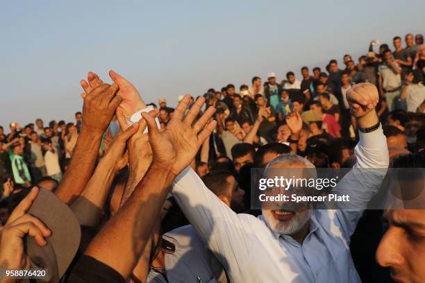 Hamas leader Ismail Haniya greets protesters at the border fence with Israel on May 15, 2018 in Gaza City, Gaza. Israeli soldiers killed over 50...