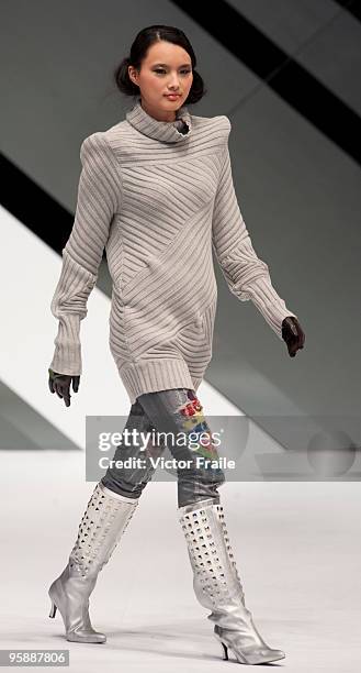 Model showcases designs by Eric Cheung on the catwalk during the International Fashion Designers' Show I as part of the Hong Kong Fashion Week...