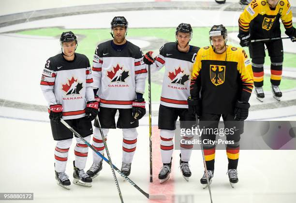 Ryan Nugent-Hopkins, Darnell Nurse, Connor McDavid of Team Canada and Leon Draisaitl of Team Germany before the IIHF World Championship game between...