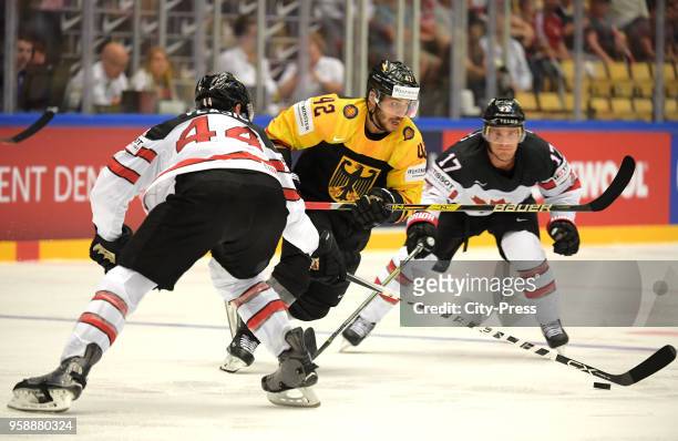 Marc-Edouard Vlasic of Team Canada, Yasin Ehliz of Team Germany and Jaden Schwartz of Team Canada during the IIHF World Championship game between...