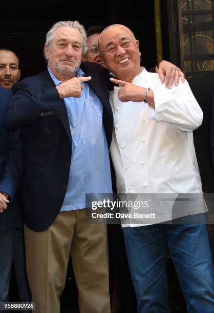 Robert De Niro and Nobu Matsuhisa pose after the opening ceremony ribbon cutting at the Nobu Hotel London Shoreditch official launch event on May 15,...