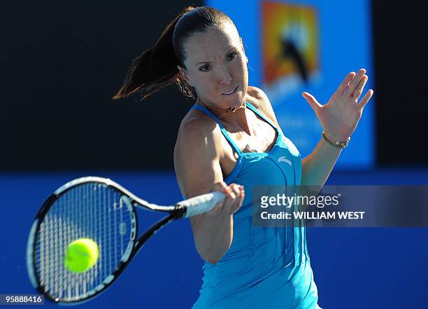 Serbian tennis player Jelena Jankovic plays a forehand return during her women's singles match against British opponent Katie O'Brien on the third...