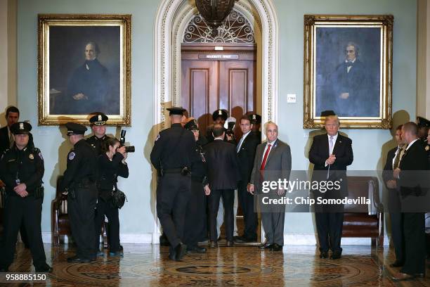 President Donald Trump claps as he leaves the weekly Senate Republican policy luncheon at the U.S. Capitol May 15, 2018 in Washington, DC. In...