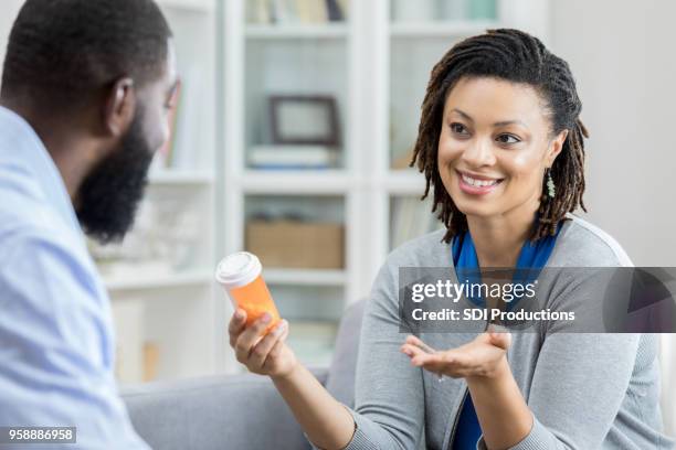 female patient asks doctor about medication side effects - drug evaluation stock pictures, royalty-free photos & images