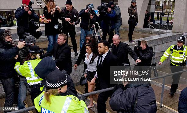 British singer Amy Winehouse arrives at Milton Keynes Magistrates Court on January 20 ahead of an appearance in court on assault charges. Ms....