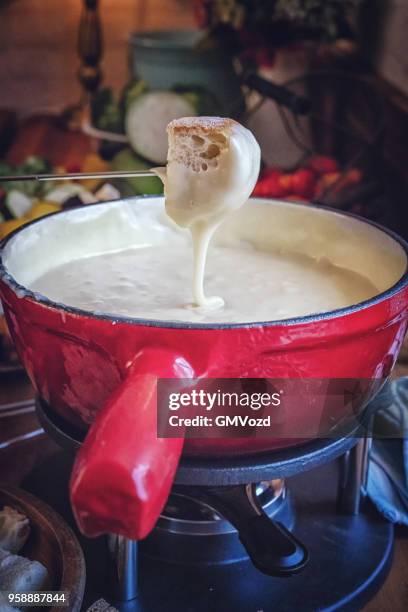 delicious swiss cheese fondue in a pot served with bread - cheese fondue stock pictures, royalty-free photos & images