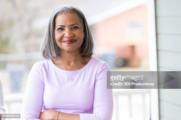 beautiful senior woman outdoors - senior woman gray hair stock pictures, royalty-free photos & images