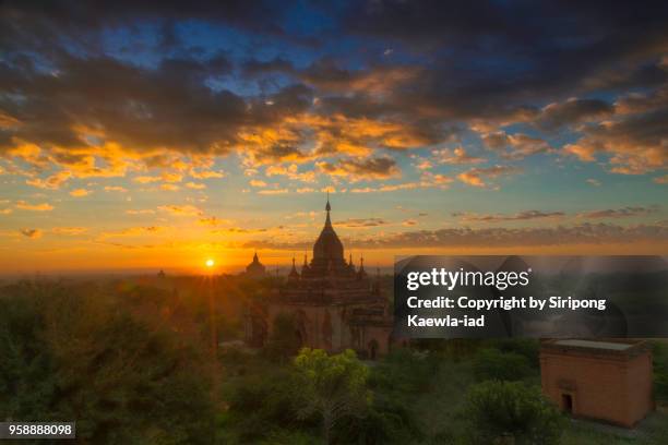 beautiful sunrise in the old bagan, myanmar. - copyright by siripong kaewla iad stock pictures, royalty-free photos & images