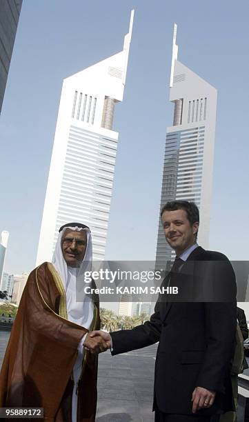 Crown Prince Frederik of Denmark Andre Henrik Christian shakes hands with Ahmed Humaid al-Tayer, governor of the Dubai International Financial Center...