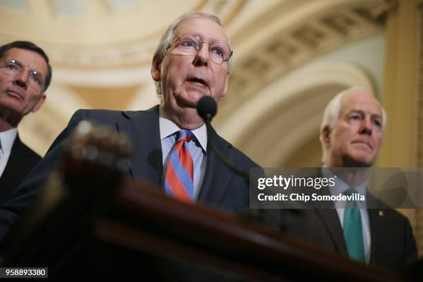 Senate Majority Leader Mitch McConnell talks to reporters with Sen. John Barrasso and Senate Majority Whip John Cornyn following the weekly Senate...