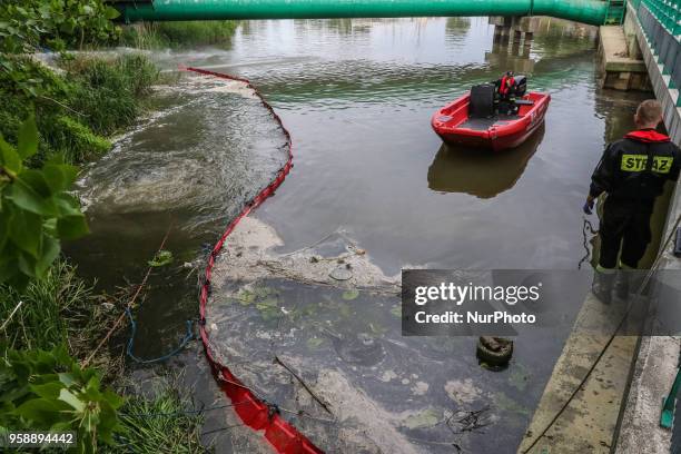 Firefighters supervising the process of draining sewage are seen in Gdansk, Poland on 15 May 2018 Over 50 milion untreated sewage is pumped directly...