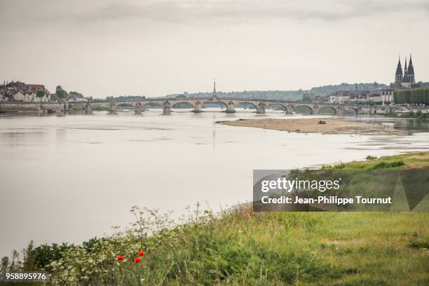 jacques-gabriel arch bridge and st. nicholas church in blois, france - jacques_gabriel stock pictures, royalty-free photos & images