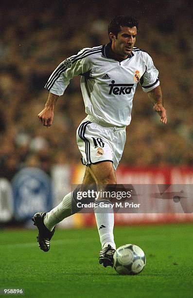 Luis Figo of Real Madrid runs with the ball during the UEFA Champions League Group match against Lazio played at the Bernabeau, in Madrid, Spain....