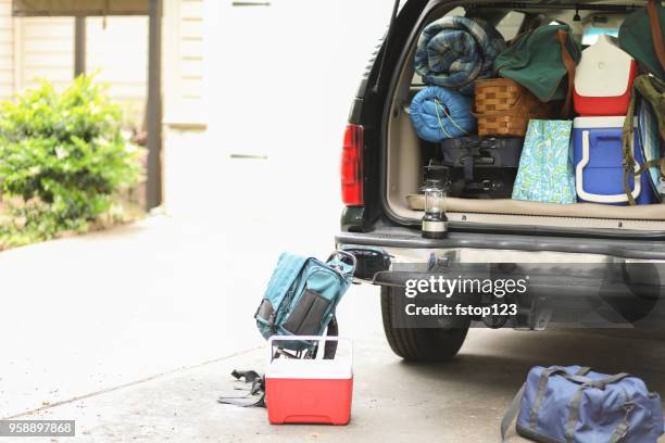 packing vehicle for camping vacation trip. - full car trunk stock pictures, royalty-free photos & images